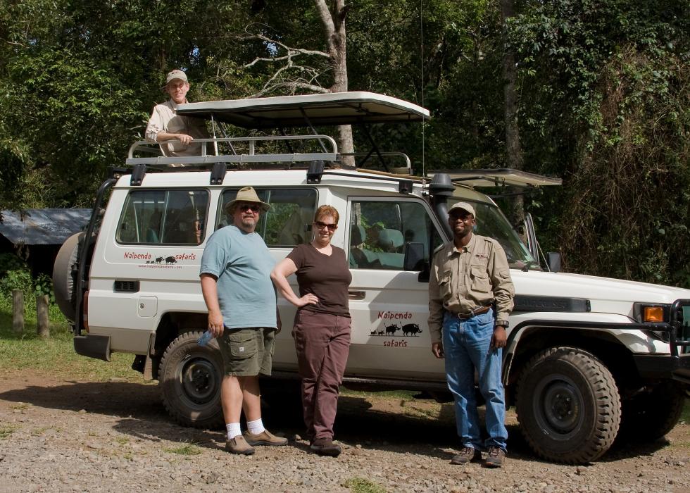 Arusha-6987.jpg - My husband Jim (too tall to stand up with this pop top), Friends Steve and Heidi and our guide Nixon