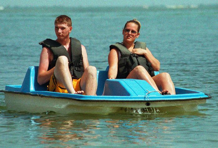 cancun4-10.jpg - Scott and Emily in paddleboat, on lagoon
